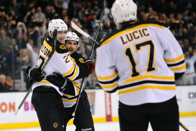 BOSTON, MA - MARCH 25: Dougie Hamilton #27, Patrice Bergeron #37 and Milan Lucic #17 of the Boston Bruins celebrate a goal against the Toronto Maple Leafs at the TD Garden on March 25, 2013 in Boston, Massachusetts.  (Photo by Brian Babineau/NHLI via Getty Images)