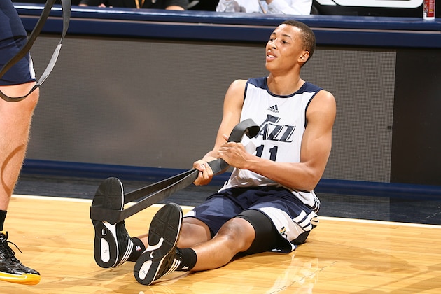 SALT LAKE CITY, UT - JULY 8:  Dante Exum #11 of the Utah Jazz stretches during an open scrimmage at Energy Solutions Arena on July 8, 2014 in Salt Lake City, Utah. NOTE TO USER: User expressly acknowledges and agrees that, by downloading and or using this Photograph, User is consenting to the terms and conditions of the Getty Images License Agreement. Mandatory Copyright Notice: Copyright 2014 NBAE (Photo by Melissa Majchrzak/NBAE via Getty Images)