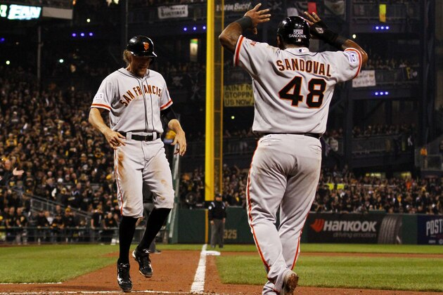 PITTSBURGH, PA - OCTOBER 01:  Hunter Pence #8 celebrates with Pablo Sandoval #48 after they scored on a four-run home run by Brandon Crawford #35 of the San Francisco Giants in the fourth inning against the Pittsburgh Pirates during the National League Wild Card game at PNC Park on October 1, 2014 in Pittsburgh, Pennsylvania.  (Photo by Justin K. Aller/Getty Images)