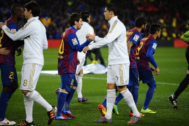 BARCELONA, SPAIN - JANUARY 25:  Lionel Messi of FC Barcelona (L) shakes hands with Cristiano Ronaldo of Real Madrid prior to the Copa del Rey quarter final second leg match between FC Barcelona and Real Madrid at Camp Nou on January 25, 2012 in Barcelona, Spain.  (Photo by David Ramos/Getty Images)