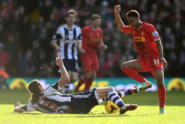 WEST BROMWICH, ENGLAND - FEBRUARY 02:  Raheem Sterling of Liverpool is tackled by Jonas Olsson of West Bromwich during the Barclays Premier League match between West Bromwich Albion and Liverpool at The Hawthorns on February 2, 2014 in West Bromwich, England.  (Photo by Jamie McDonald/Getty Images)