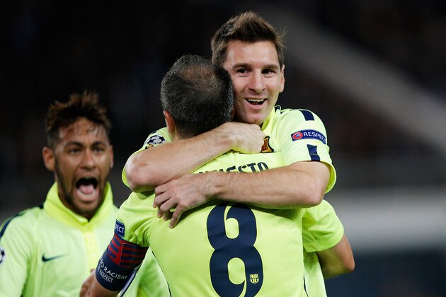 PARIS, FRANCE - SEPTEMBER 30:  Lionel Messi of Barcelona celebrates scoring his teams first goal of the game with Andres Iniesta during the Group F UEFA Champions League match between Paris Saint-Germain v FC Barcelona held at Parc des Princes on September 30, 2014 in Paris, France.  (Photo by Dean Mouhtaropoulos/Getty Images)