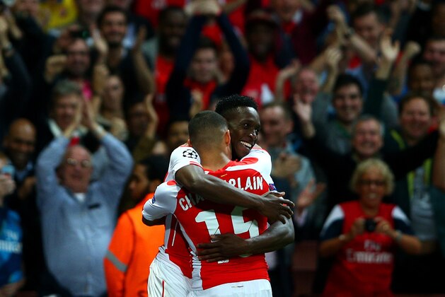 LONDON, ENGLAND - OCTOBER 01:  Danny Welbeck of Arsenal celebrates with team-mate Alex Oxlade-Chamberlain after scoring his team's fourth and his third goal during the UEFA Champions League group D match between Arsenal FC and Galatasaray AS at Emirates Stadium on October 1, 2014 in London, United Kingdom.  (Photo by Paul Gilham/Getty Images)