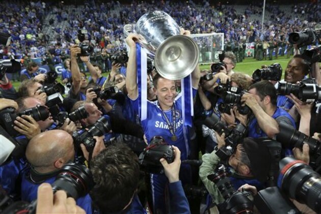 Chelsea's John Terry holds the trophy at the end of the Champions League final soccer match between Bayern Munich and Chelsea in Munich, Germany Saturday May 19, 2012. Chelsea's Didier Drogba scored the decisive penalty in the shootout as Chelsea beat Bayern Munich to win the Champions League final after a dramatic 1-1 draw on Saturday. (AP Photo/Matt Dunham)