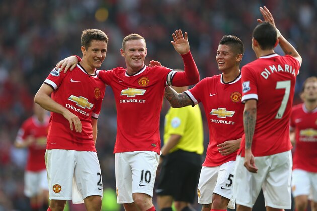 MANCHESTER, ENGLAND - SEPTEMBER 14: Wayne Rooney of Manchester United celebrates scoring the third goal with team-mates Ander Herrera (L), Marcos Rojo and Angel Di Maria during the Barclays Premier League match between Manchester United and Queens Park Rangers at Old Trafford on September 14, 2014 in Manchester, England. (Photo by Alex Livesey/Getty Images) MANCHESTER, ENGLAND - SEPTEMBER 14: Wayne Rooney of Manchester United celebrates scoring the third goal with team-mates Ander Herrera (L), Marcos Rojo and Angel Di Maria during the Barclays Premier League match between Manchester United and Queens Park Rangers at Old Trafford on September 14, 2014 in Manchester, England. (Photo by Alex Livesey/Getty Images)