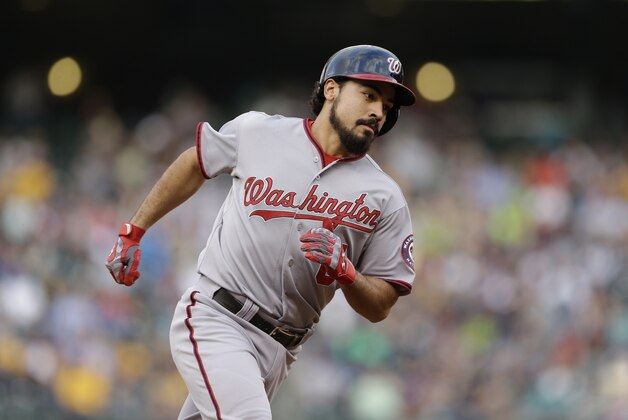 Washington Nationals' Anthony Rendon rounds the bases on his home run against the Seattle Mariners in a baseball game Friday, Aug. 29, 2014, in Seattle. (AP Photo/Elaine Thompson)