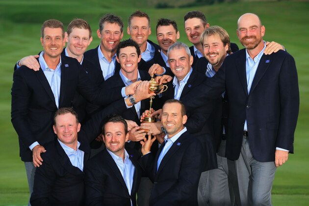 AUCHTERARDER, SCOTLAND - SEPTEMBER 28:  Europe team captain Paul McGinley poses with the Ryder Cup trophy and his team after the Singles Matches of the 2014 Ryder Cup on the PGA Centenary course at the Gleneagles Hotel on September 28, 2014 in Auchterarder, Scotland.  (Photo by David Cannon/Getty Images)