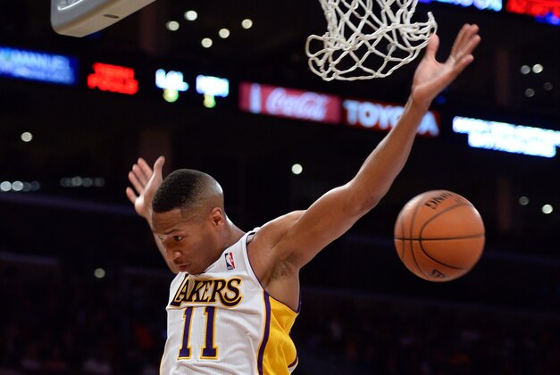 Apr 13, 2014; Los Angeles, CA, USA;  Los Angeles Lakers forward Wesley Johnson (11) dunks on a break away during the second quarter action the Memphis Grizzlies at Staples Center. Mandatory Credit: Robert Hanashiro-USA TODAY Sports