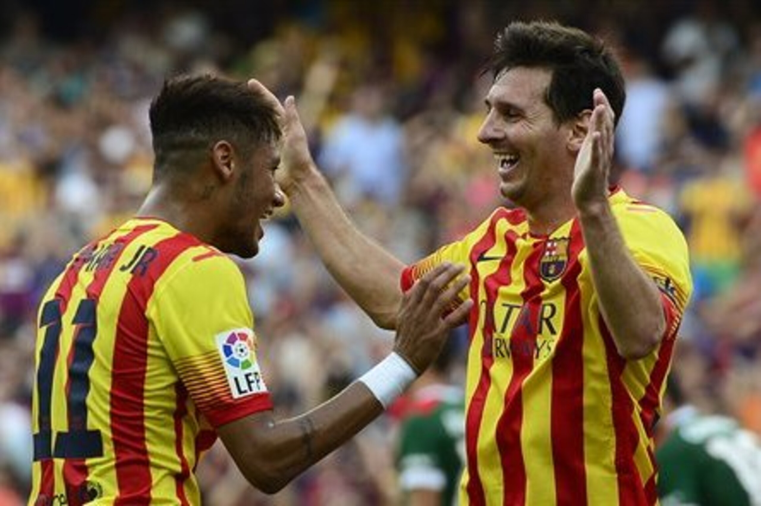 FC Barcelona's Neymar, from Brazil, left, celebrates scoring with teammate Lionel Messi, from Argentina, during a Spanish La Liga soccer match between FC Barcelona and Athletic Bilbao at the Camp Nou stadium in Barcelona, Spain, Saturday, Sept. 13, 2014. (AP Photo/Manu Fernandez)