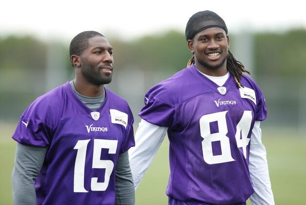 Jul 27, 2013; Mankato, MN, USA; Minnesota Vikings wide receiver Greg Jennings (15) and wide receiver Cordarrelle Patterson (84) leave the field after drills at training camp at Blakeslee Fields. Mandatory Credit: Bruce Kluckhohn-USA TODAY Sports