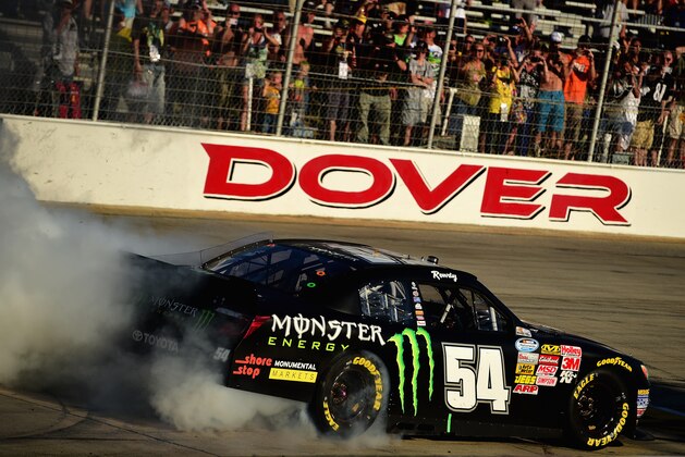 DOVER, DE - SEPTEMBER 27:  Kyle Busch, driver of the #54 Monster Energy Toyota, celebrates after winning the NASCAR Nationwide Series Dover 200 at Dover International Speedway on September 27, 2014 in Dover, Delaware.  (Photo by Patrick Smith/Getty Images)