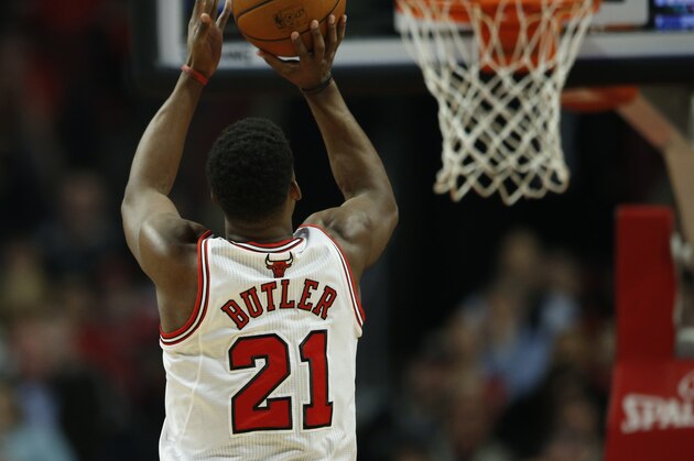 Chicago Bulls guard Jimmy Butler shoots against the Boston Celtics during an NBA basketball game in Chicago, Monday, March 31, 2014. The Bulls won 94-80. (AP Photo/Kamil Krzaczynski)
