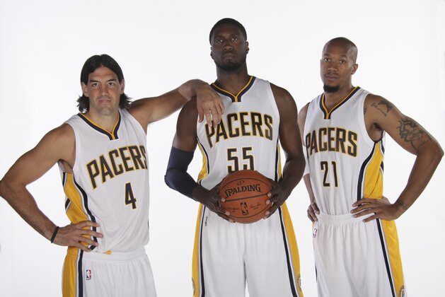 INDIANAPOLIS - SEPTEMBER 29: Luis Scola #4, Roy Hibbert #55 and David West #21 of the Indiana Pacers during the Pacers media day at Bankers Life Fieldhouse on September 29, 2014 in Indianapolis, Indiana.  NOTE TO USER: User expressly acknowledges and agrees that, by downloading and or using this Photograph, user is consenting to the terms and condition of the Getty Images License Agreement. Mandatory Copyright Notice: 2014 NBAE  (Photo by Ron Hoskins/NBAE via Getty Images)