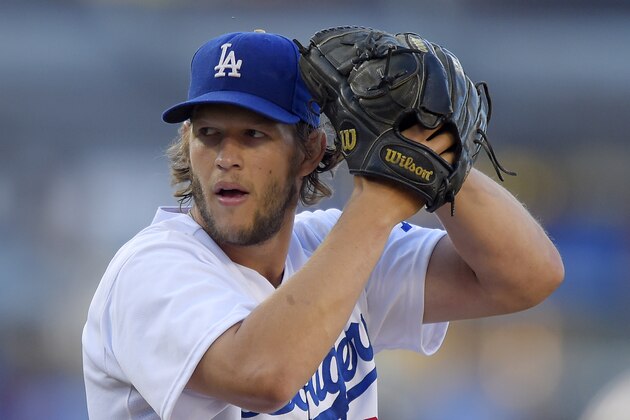 Los Angeles Dodgers starting pitcher Clayton Kershaw winds up during the first inning of a baseball game against the Milwaukee Brewers, Saturday, Aug. 16, 2014, in Los Angeles. (AP Photo/Mark J. Terrill)
