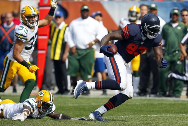 Chicago Bears tight end Martellus Bennett (83) catches a pass in front of Green Bay Packers cornerback Sam Shields (37) during an NFL game at Soldier Field in Chicago on Sunday, Sept. 28, 2014. (Jeff Haynes/AP Images for Panini)