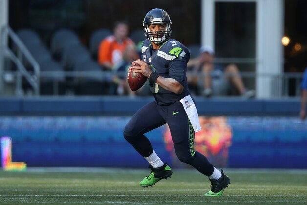 SEATTLE, WA - SEPTEMBER 21:  Quarterback Russell Wilson #3 of the Seattle Seahawks runs with the ball against the Denver Broncos at CenturyLink Field on September 21, 2014 in Seattle, Washington.  (Photo by Jeff Gross/Getty Images)