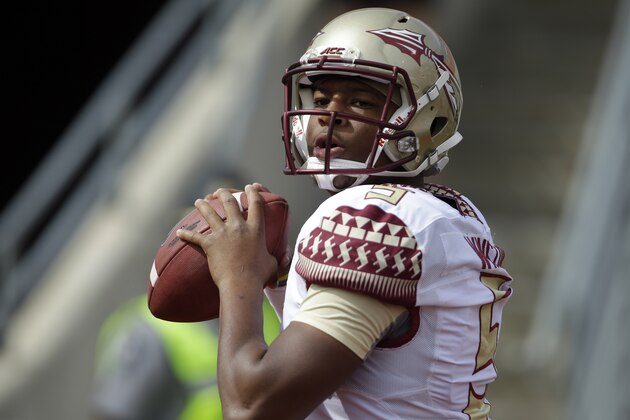 Florida State's quarterback Jameis Winston warms up prior to an NCAA college football game against North Carolina State in Raleigh, N.C., Saturday, Sept. 27, 2014. (AP Photo/Gerry Broome)