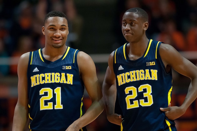 Mar 4, 2014; Champaign, IL, USA; Michigan Wolverines guard Zak Irvin (21) and Michigan Wolverines guard Caris LeVert (23) during the second half against the Illinois Fighting Illini at State Farm Center. Michigan defeated Illinois 84-53. Mandatory Credit: Bradley Leeb-USA TODAY Sports Mar 4, 2014; Champaign, IL, USA; Michigan Wolverines guard Zak Irvin (21) and Michigan Wolverines guard Caris LeVert (23) during the second half against the Illinois Fighting Illini at State Farm Center. Michigan defeated Illinois 84-53. Mandatory Credit: Bradley Leeb-USA TODAY Sports