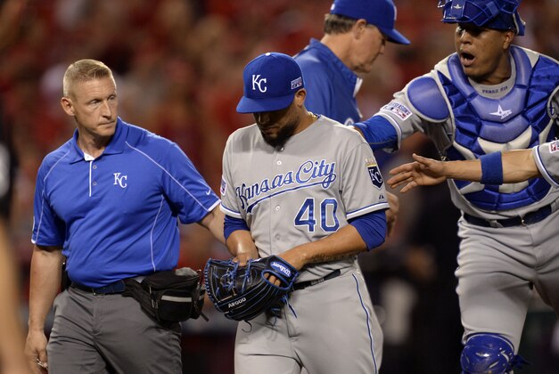 Oct 2, 2014; Anaheim, CA, USA; Kansas City Royals relief pitcher Kelvin Herrera (40) is taken out of the game with an injury during the seventh inning in game one of the 2014 American League divisional series against the Los Angeles Angels at Angel Stadium of Anaheim. Mandatory Credit: Robert Hanashiro-USA TODAY Sports