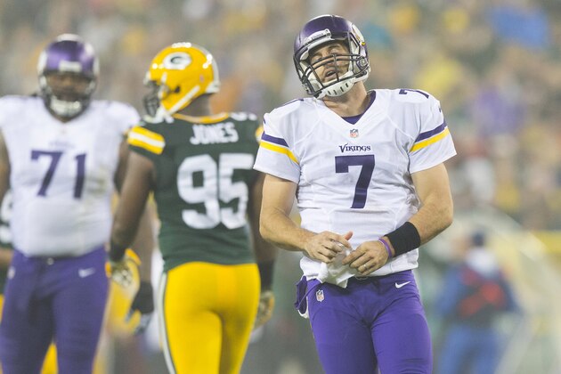 Oct 2, 2014; Green Bay, WI, USA; Minnesota Vikings quarterback Christian Ponder (7) reacts following a play during the first quarter against the Green Bay Packers at Lambeau Field. Mandatory Credit: Jeff Hanisch-USA TODAY Sports