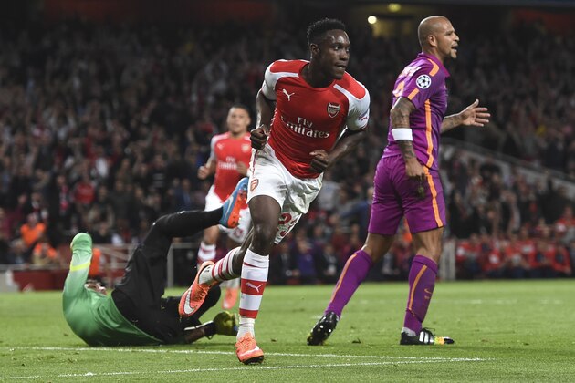 Arsenal's Danny Welbeck , celebrates after scoring against Galatasaray during the Champions League Group D soccer match between Arsenal  and Galatasaray , at the Emirates Stadium in London, on Wednesday, Oct 1, 2014. (AP Photo/ Tim Ireland)