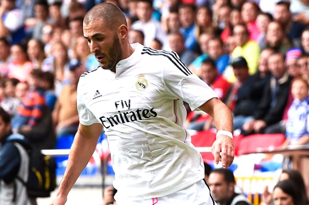LA CORUNA, SPAIN - SEPTEMBER 20:  Karim Benzema of Real Madrid CF runs with the ball during the La Liga match between RC Deportivo La Coruna and Real Madrid CF at Riazor Stadium on September 20, 2014 in La Coruna, Spain.  (Photo by David Ramos/Getty Images)