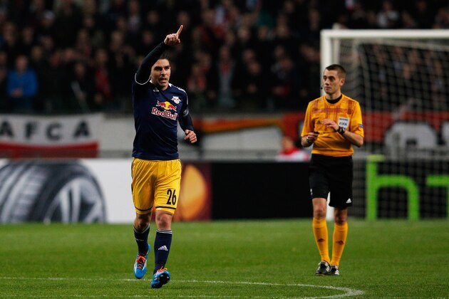 AMSTERDAM, NETHERLANDS - FEBRUARY 20:  Jonathan Soriano (#26) of Salzburg celebrates scoring the first goal of the game during the UEFA Europa League Round of 32 match between Ajax Amsterdam and FC Salzburg at Amsterdam Arena on February 20, 2014 in Amsterdam, Netherlands.  (Photo by Dean Mouhtaropoulos/Getty Images)