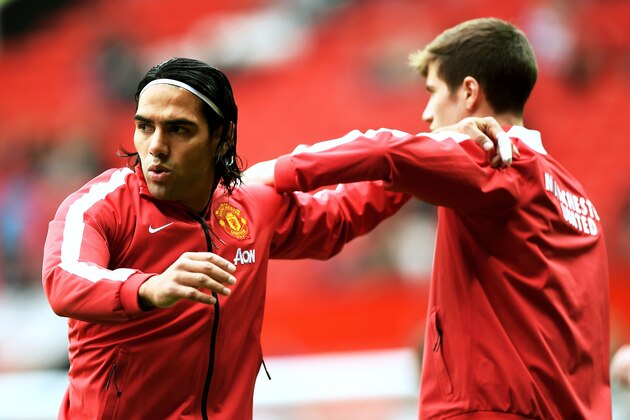 MANCHESTER, ENGLAND - SEPTEMBER 27:  Radamel Falcao Garcia of Manchester United warms up with team-mate Paddy McNair before the Barclays Premier League match between Manchester United and West Ham United at Old Trafford on September 27, 2014 in Manchester, England.  (Photo by Laurence Griffiths/Getty Images)