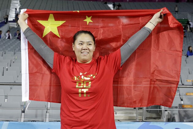 China's Zhang Wenxiu celebrates after winning the women's hammer throw competition at the 17th Asian Games in Incheon, South Korea, Sunday, Sept. 28, 2014. (AP Photo/Lee Jin-man)