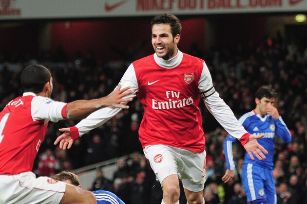 LONDON, ENGLAND - DECEMBER 27:  Cesc Fabregas of Arsenal celebrates Arsenal's second goal with Theo Walcott (L) during the Barclays Premier League match between Arsenal and Chelsea at the Emirates Stadium on December 27, 2010 in London, England.  (Photo by Shaun Botterill/Getty Images)