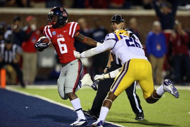 Oct 19, 2013; Oxford, MS, USA; Mississippi Rebels running back Jaylen Walton (6) advances the ball for a touchdown during the game against the LSU Tigers at Vaught-Hemingway Stadium. Mississippi Rebels defeat the LSU Tigers 27-24.  Mandatory Credit: Spruce Derden-USA TODAY Sports