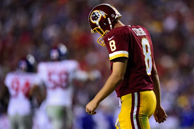 LANDOVER, MD - SEPTEMBER 25: Quarterback Kirk Cousins #8 of the Washington Redskins walks off the field after throwing an interception in the third quarter against the New York Giants at FedExField on September 25, 2014 in Landover, Maryland. (Photo by Patrick Smith/Getty Images)