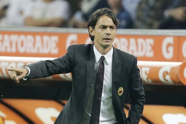 AC Milan coach Filippo Inzaghi gestures during the Serie A soccer match between AC Milan and Juventus at the San Siro stadium in Milan, Italy, Saturday, Sept. 20, 2014. (AP Photo/Antonio Calanni)