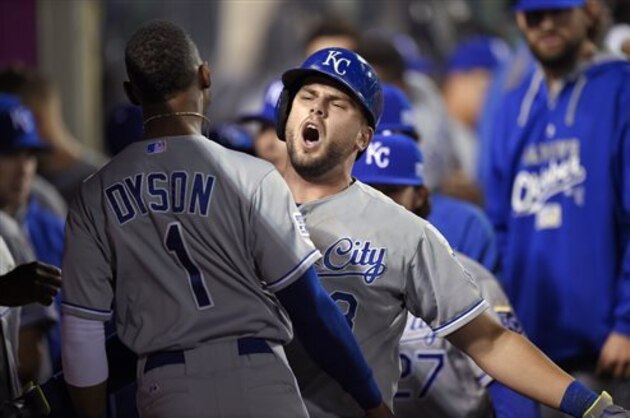 Kansas City Royals' Mike Moustakas celebrates his home run with Jarrod Dyson, during the 11th inning against the Los Angeles Angels in Game 1 of baseball's AL Division Series in Anaheim, Calif., Thursday, Oct. 2, 2014. (AP Photo/Mark J. Terrill)