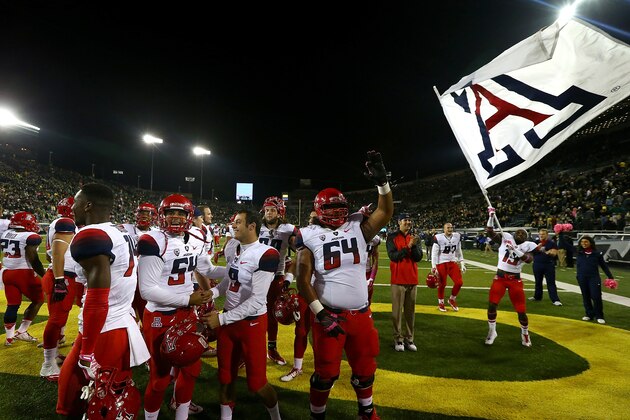 EUGENE, OR - OCTOBER 02:  The Arizona Wildcats celebrate their 31-24 victory over the Oregon Ducks at Autzen Stadium on October 2, 2014  in Eugene, Oregon.  (Photo by Jonathan Ferrey/Getty Images)
