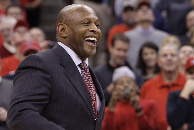 Bob Knight, right, a member of Ohio State's 1960 national championship basketball team, stands at halfcourt with Archie Griffin after being honored during half time of Ohio State's NCAA college basketball game against Lamar on Tuesday, Dec. 20, 2011, in Columbus, Ohio. (AP Photo/Jay LaPrete)