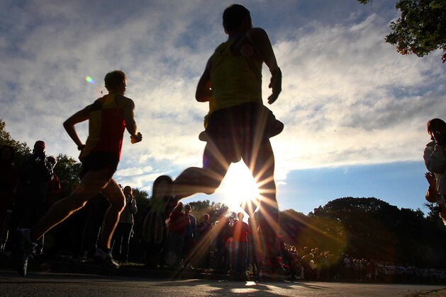 Elite Runners race around Lake Harriett during the Medtronic Twin Cities Marathon in Minneapolis, Sunday, Oct. 6, 2013. (AP Photo/Andy Clayton-King)