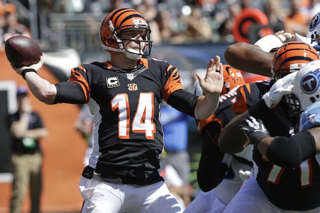 Cincinnati Bengals quarterback Andy Dalton passes against the Tennessee Titans in the first half of an NFL football game, Sunday, Sept. 21, 2014, in Cincinnati. Cincinnati won 33-7. (AP Photo/Al Behrman)