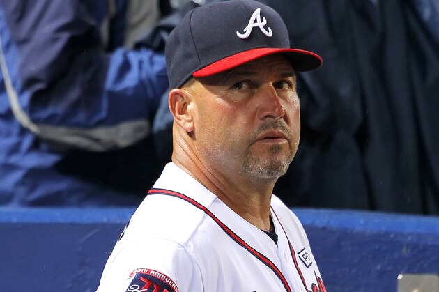 Atlanta Braves manager Fredi Gonzalez (33) watches on in the fifth inning of a baseball game against the Washington Nationals Monday, Sept. 15, 2014, in Atlanta. The Nationals won 4-2. (AP Photo/Todd Kirkland)
