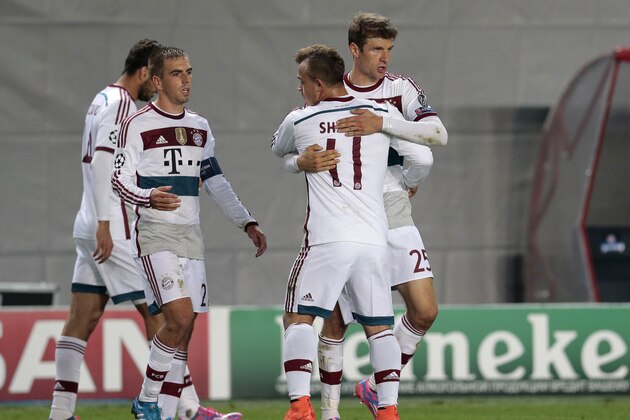 Bayern's Xherdan Shaqiri, 3rd left and Thomas Mueller, right, congratulate each other at the end of the Champions League Group E soccer match between CSKA Moscow and Bayern Munich at the Arena Khimki stadium in Moscow, Russia, Tuesday Sept. 30, 2014. Bayern won the match 1-0. (AP Photo/Ivan Sekretarev)
