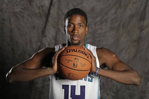 Charlotte Hornets' Michael Kidd-Gilchrist poses for a photo during the NBA basketball team's media day in Charlotte, N.C., Monday, Sept. 29, 2014. (AP Photo/Chuck Burton)