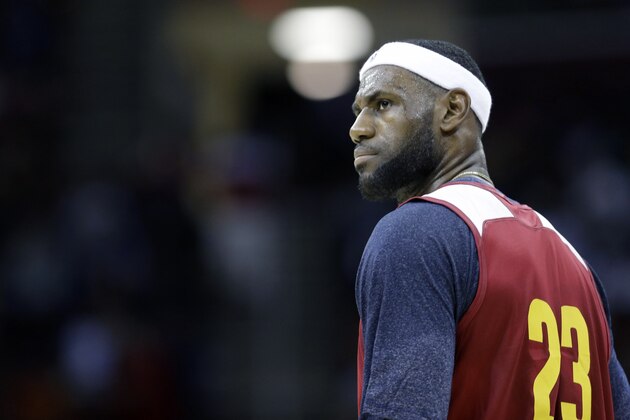 Cleveland Cavaliers' LeBron James looks on during an NBA scrimmage basketball game Wednesday, Oct. 1, 2014, in Cleveland. (AP Photo/Tony Dejak)