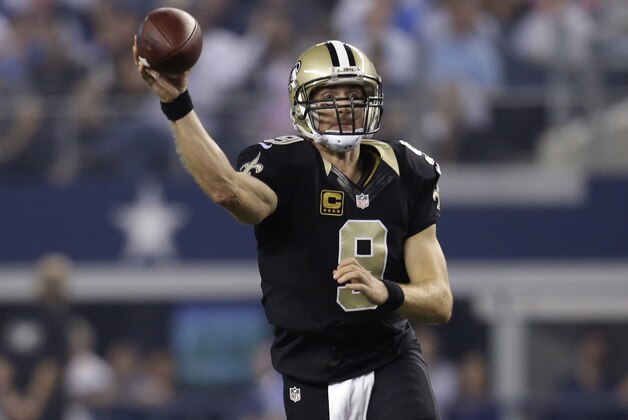 New Orleans Saints quarterback Drew Brees (9) passes during the first half of an NFL football game against the Dallas Cowboys, Sunday, Sept. 28, 2014, in Arlington, Texas. (AP Photo/Tim Sharp)