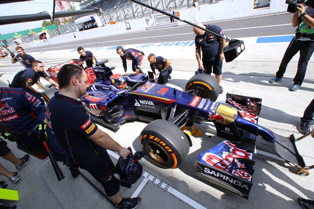 Toro Rosso driver Max Verstappen of the Netherlands stops at the pit during the first practice session for Sunday's Japanese Formula One Grand Prix at the Suzuka Circuit in Suzuka, central Japan, Friday, Oct. 3, 2014. (AP Photo/Shizuo Kambayashi)