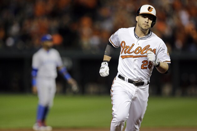 Baltimore Orioles' Steve Pearce rounds the bases after hitting a three-run home run in the first inning of a baseball game against the Toronto Blue Jays, Tuesday, Sept. 16, 2014, in Baltimore. (AP Photo/Patrick Semansky)