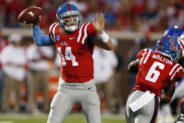 Mississippi quarterback Bo Wallace (14) readies to pass in the first half of an NCAA college football game against Memphis in Oxford, Miss., Saturday, Sept. 27, 2014.  (AP Photo/Rogelio V. Solis)