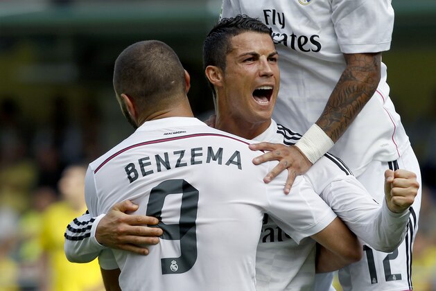 Real Madrid's Cristiano Ronaldo, from Portugal celebrates with Karim Benzema, from France, after scoring against Villarreal during a Spanish La Liga soccer match at the Madrigal stadium in Villarreal, Spain, on Saturday, Sept. 27, 2014.(AP Photo/Alberto Saiz) Real Madrid's Cristiano Ronaldo, from Portugal celebrates with Karim Benzema, from France, after scoring against Villarreal during a Spanish La Liga soccer match at the Madrigal stadium in Villarreal, Spain, on Saturday, Sept. 27, 2014.(AP Photo/Alberto Saiz)