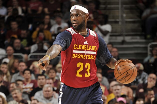 CLEVELAND, OH - OCTOBER 1:  LeBron James #23 of the Cleveland Cavaliers controls the ball during a scrimmage at The Quicken Loans Arena on October 1, 2014 in Independence, Ohio. NOTE TO USER: User expressly acknowledges and agrees that, by downloading and/or using this Photograph, user is consenting to the terms and conditions of the Getty Images License Agreement. Mandatory Copyright Notice: Copyright 2014 NBAE (Photo by David Liam Kyle/NBAE via Getty Images)