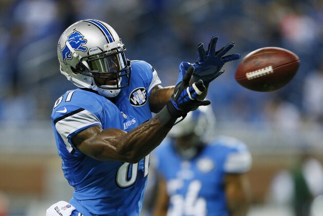 Detroit Lions wide receiver Calvin Johnson makes a catch during warm-ups before an NFL football game against Green Bay in Detroit, Sunday, Sept. 21, 2014. (AP Photo/Rick Osentoski)