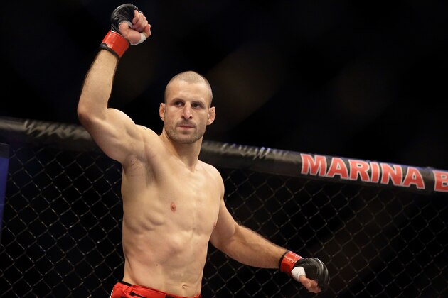 SINGAPORE - JANUARY 04:  Tarec Saffiedine reacts as he enters the arena during the UFC Fight Night Singapore welterweight bout at Marina Bay Sands on January 4, 2014 in Singapore.  (Photo by Suhaimi Abdullah/Getty Images)